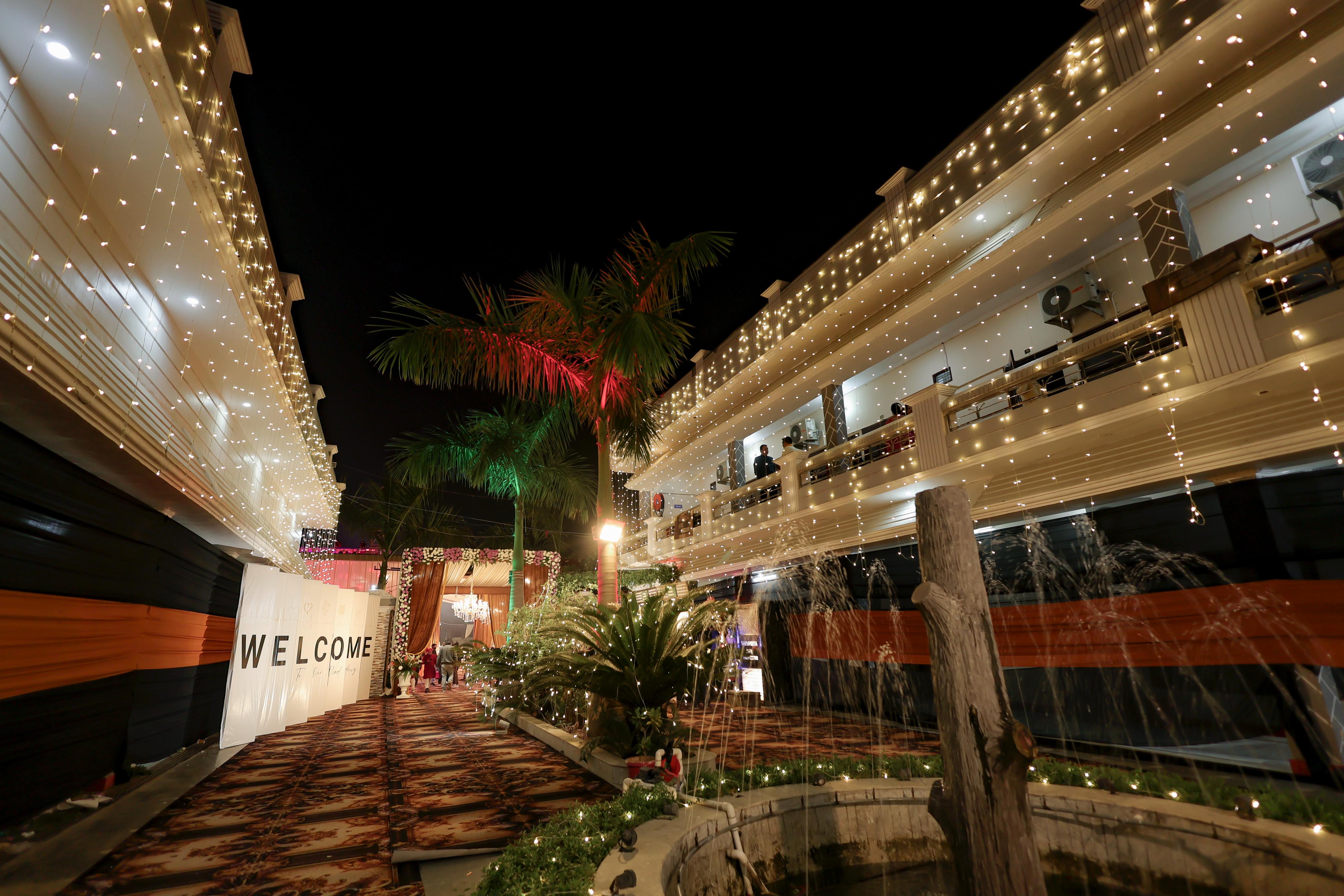 Raj Garden night entry with lights and fountain